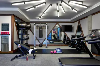 a gym with cardio equipment in a room at Moxy Columbus Short North in Columbus
