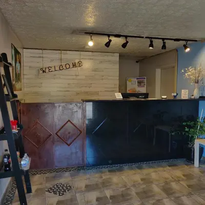 a bar in a room with a wooden wall at Travel Inn in Delaware