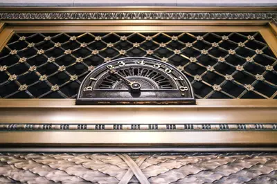 a clock sitting on top of a fireplace at BLU-Tique, Akron, a Tribute Portfolio Hotel in Akron