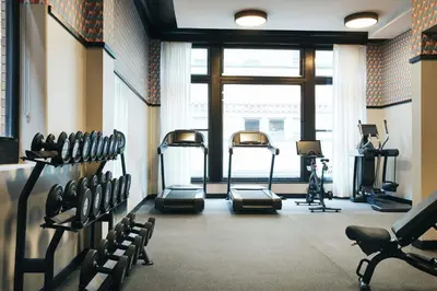 a gym with several exercise bikes in a room at Kinley Cincinnati Downtown, a Tribute Portfolio Hotel in Cincinnati