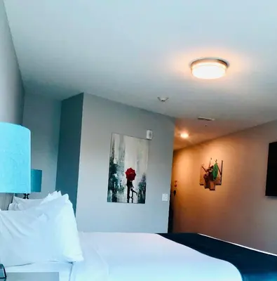 a bedroom with a bed and a painting on the wall at Athens Central Hotel in Athens