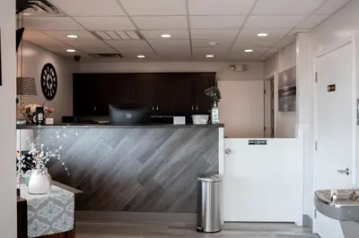 an office with a reception desk and a counter at West Bank Inn in Celina