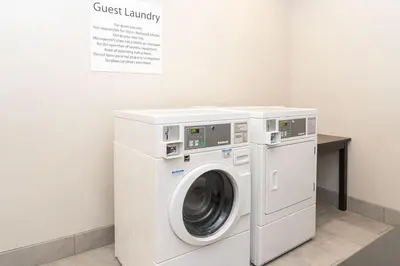 a white washer and dryer in a room at Holiday Inn Express & Suites Columbus - Easton Area by IHG in Gahanna