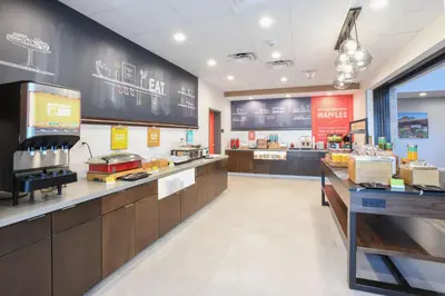 a fast food restaurant with a chalkboard on the wall at Hampton Inn & Suites Cincinnati Liberty Township in West Chester