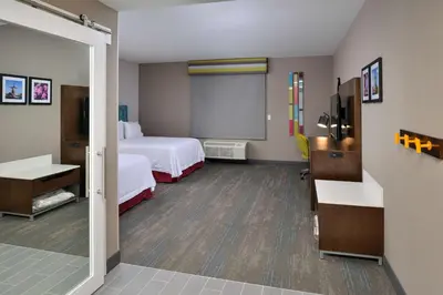 a hotel room with two beds and a chalkboard at Hampton Inn & Suites Adrian, Mi in Adrian