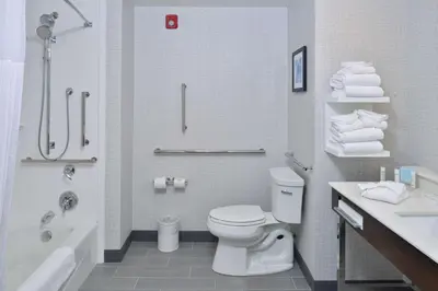 a bathroom with a toilet and a tub and a sink at Hampton Inn & Suites Adrian, Mi in Adrian