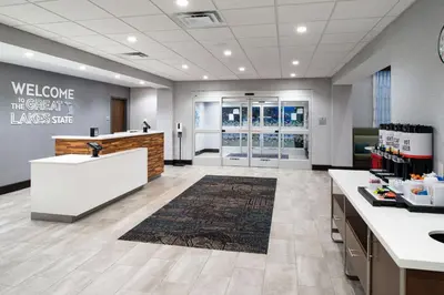 a lobby of a store with a counter and aasteryasteryasteryasteryasteryastery at Hampton Inn & Suites Adrian, Mi in Adrian