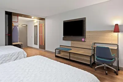 a hotel room with a desk and a tv at Tru By Hilton Sharonville, OH in Cincinnati