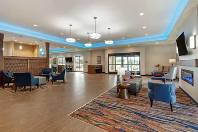 a lobby of a hospital with couches and chairs at Comfort Suites Dry Ridge in Dry Ridge