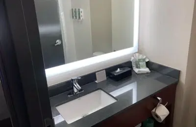 a bathroom with a sink and a mirror at Best Western Lexington Inn in Lexington