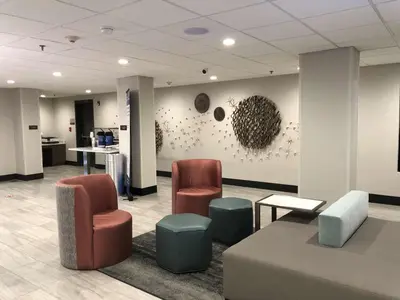 a waiting room with two chairs and a table at Best Western Lexington Inn in Lexington