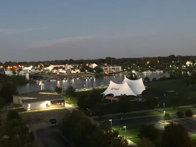 a view of a marina at night at Ariel Broadway Hotel in Lorain