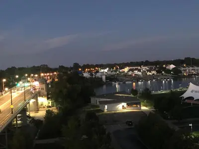 a view of a city at night with a marina at Ariel Broadway Hotel in Lorain