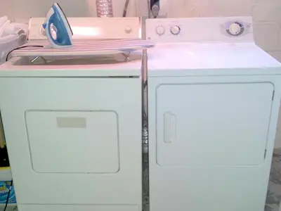 a small white refrigerator with a pink counter top at The Wayfaring Buckeye Hostel in Columbus