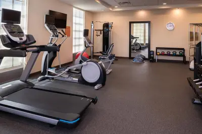 a gym with treadmills and cardio equipment in a room at Home2 Suites By Hilton Columbus/West, OH in Columbus