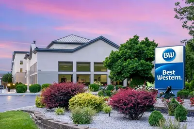 a sign in front of a best western building at Best Western Suites Columbus in Columbus