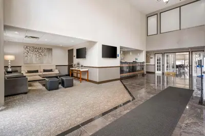 a large living room with a couch and a table at Best Western Suites Columbus in Columbus