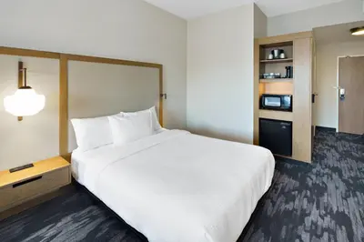 a large white bed in a hotel room at Fairfield Inn & Suites Columbus New Albany in New Albany
