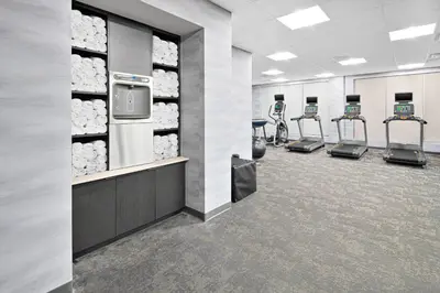 a gym with rows of treadmills and machines at Fairfield Inn & Suites Columbus New Albany in New Albany