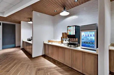 a restaurant with a bar with a flat screen tv at Fairfield Inn & Suites Columbus New Albany in New Albany