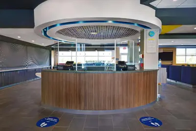 a lobby with a reception counter in a building at Tru By Hilton Monroe, MI in Monroe