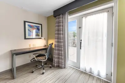 an office with a desk and a chair and a window at Holiday Inn Express - Columbus Downtown by IHG in Columbus