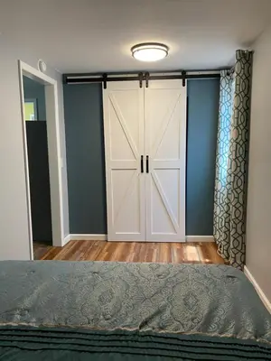 a bedroom with a large closet with a door at Cozy One Bedroom House in Adrian