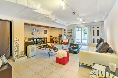 a living room with a couch and a table at Contemporary Cincinnati Apt with WiFi, Near Kenwood! in Cincinnati