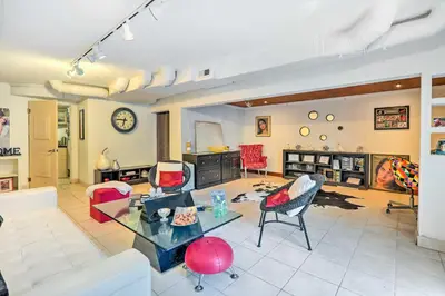 a living room with a table and chairs at Contemporary Cincinnati Apt with WiFi, Near Kenwood! in Cincinnati