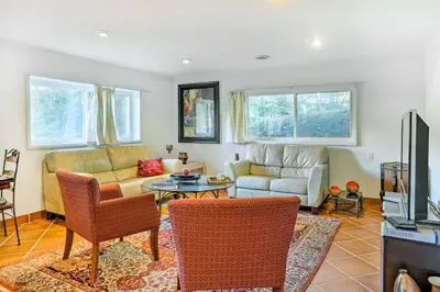 a living room with a couch and a table at Contemporary Cincinnati Apt with WiFi, Near Kenwood! in Cincinnati