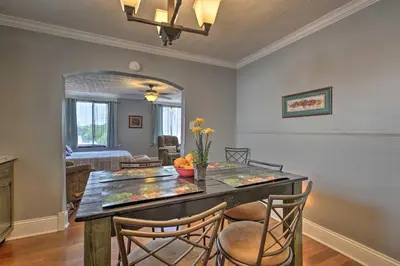 a dining room with a table with four chairs at 2 Mi to Ark Encounter Updated Williamstown Apt! in Williamstown