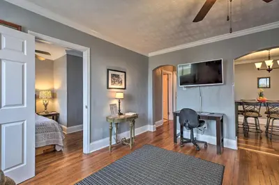 a bedroom with a bed and a desk and a television at 2 Mi to Ark Encounter Updated Williamstown Apt! in Williamstown