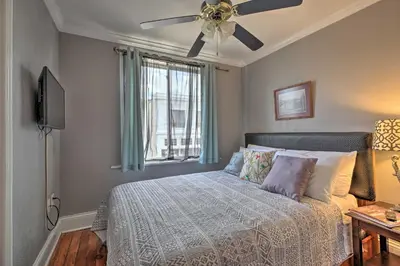 a bedroom with a bed with a ceiling fan at 2 Mi to Ark Encounter Updated Williamstown Apt! in Williamstown