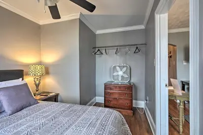 a bedroom with a bed and a dresser and a mirror at 2 Mi to Ark Encounter Updated Williamstown Apt! in Williamstown