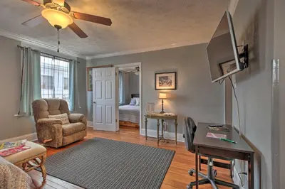 a living room with a tv and a couch and a chair at 2 Mi to Ark Encounter Updated Williamstown Apt! in Williamstown