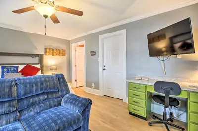 a living room with a couch and a desk at Modern Studio Apartment in Central Williamstown! in Williamstown