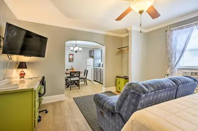 a living room with a couch and a flat screen tv at Modern Studio Apartment in Central Williamstown! in Williamstown