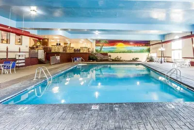 a large swimming pool in a hotel room at Wingate by Wyndham Marietta Conference Center Ohio in Marietta