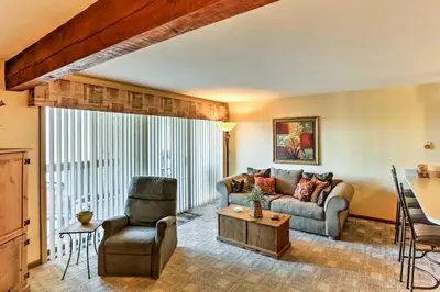 a living room with a couch and a chair at Waterfront Port Clinton Condo with Pool Access! in Port Clinton