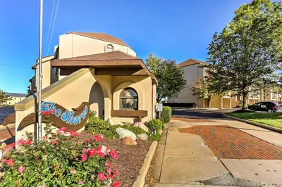 a small building with a sign on the side of it at Waterfront Port Clinton Condo with Pool Access! in Port Clinton
