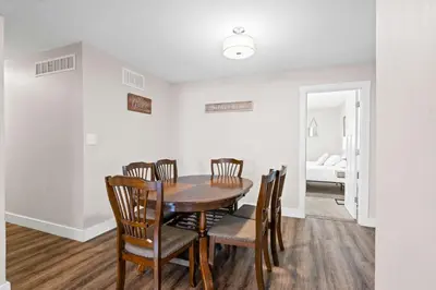 a dining room with a table and chairs at 4BR, 3Bath for 11, Near Ark, Plenty of Free Parking in Williamstown