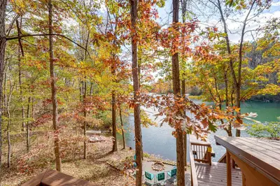 a view of a lake from the deck of a cabin at Hocking Hills Lake Gem with Hot Tub, Dock, 100 Acres in Hamden