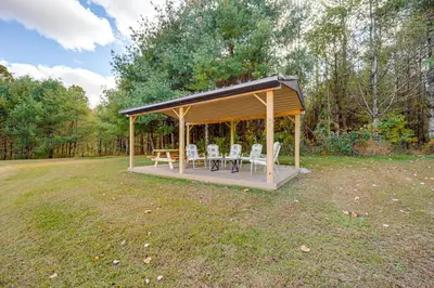 a gazebo with a table and chairs in a field at Hocking Hills Lake Gem with Hot Tub, Dock, 100 Acres in Hamden