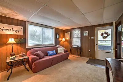 a living room with a couch and a table at Burgettstown Home - 7 Mi to KeyBank Pavilion in Burgettstown