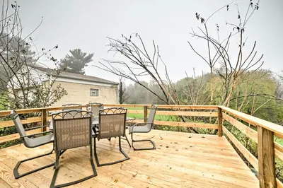 a patio with chairs and a table on a wooden deck at Burgettstown Home - 7 Mi to KeyBank Pavilion in Burgettstown