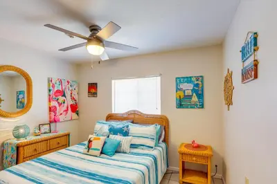 a bedroom with a bed and a ceiling fan at Waterfront Middle Bass Condo with Pool Access! in Put-in-Bay