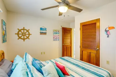 a bedroom with a bed and a ceiling fan at Waterfront Middle Bass Condo with Pool Access! in Put-in-Bay