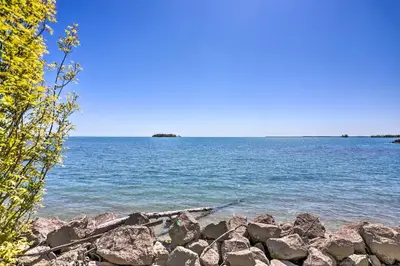 a view of a large body of water with rocks at Waterfront Middle Bass Condo with Pool Access! in Put-in-Bay