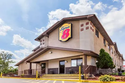 a fast food building with a sign on it at Super 8 by Wyndham Dunbar/Charleston Area in Charleston