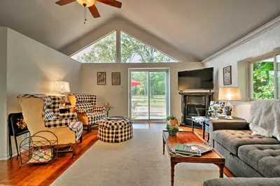 a living room filled with furniture and a large window at Ottawa Lake Home with BBQ and Patio, 15 Mi to Toledo in Sylvania